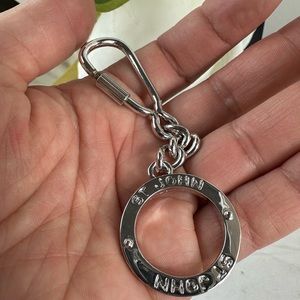 St. John silver tone bag charm